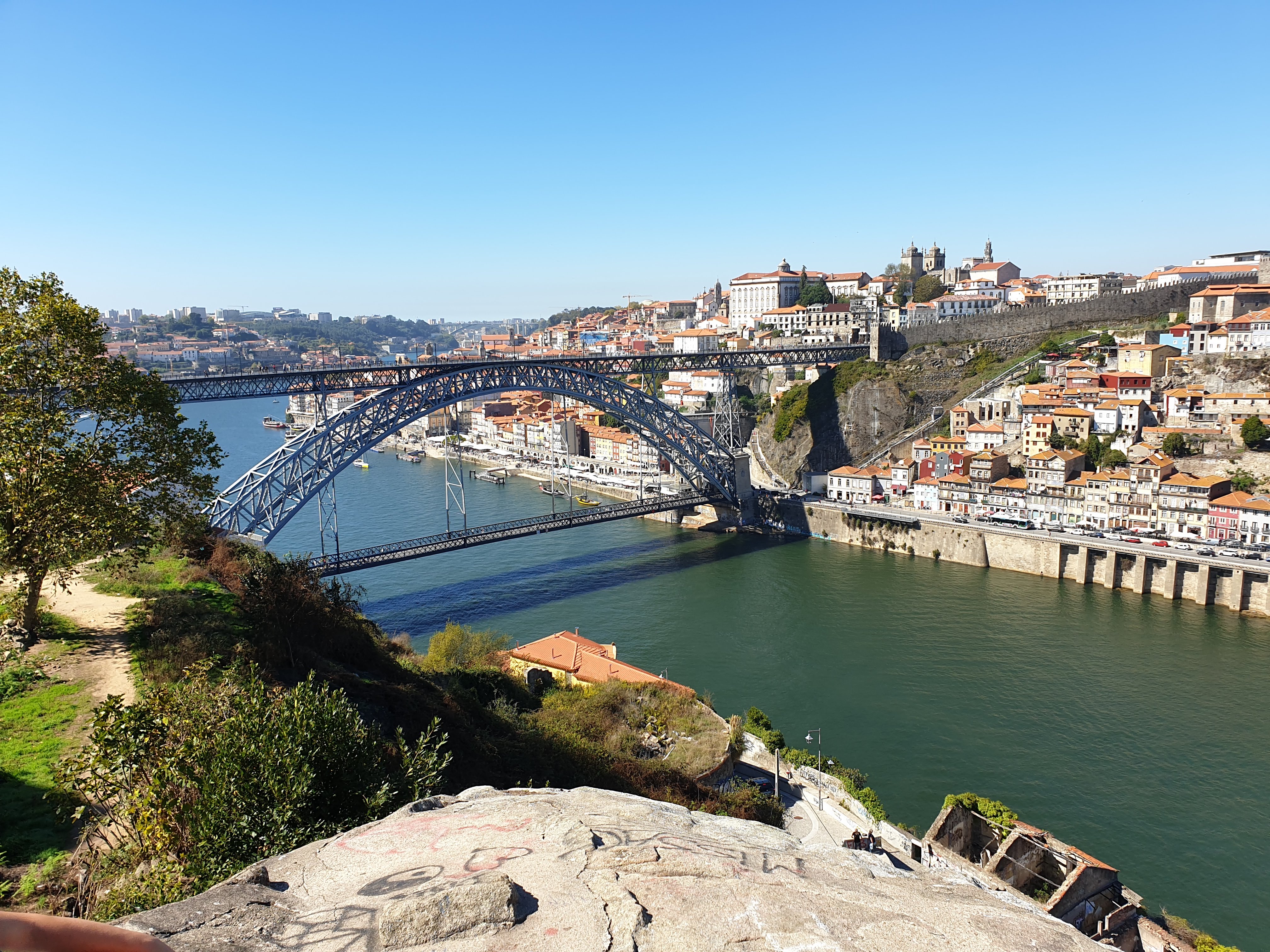 Porto's iconic Dom Luís I Bridge spanning the Douro River with historic cityscape